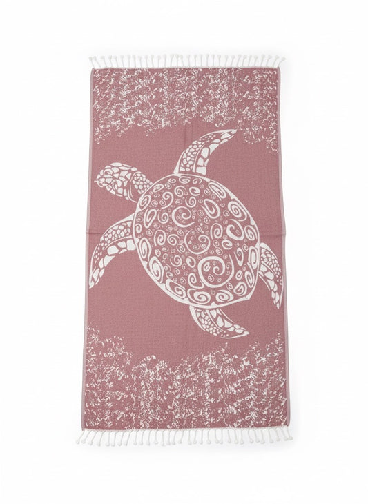 Towel with a turtle design on a pink background