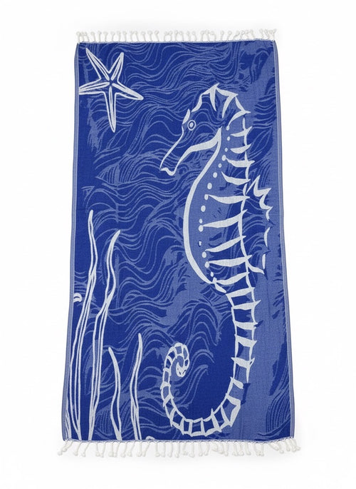 Blue towel with white seahorse and starfish design on a white background
